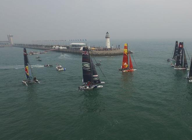 2016 Act 2, Extreme Sailing Series Qingdao – Aerial photo of the fleet in Fushan Bay – The fleet will compete in open water racing on day one followed by Stadium Racing in Fushan Bay on the remaining days, a stadium venue notorious for its temperamental weather. ©  Z-Drones